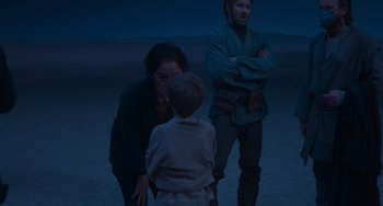 Movie still from “Obi-Wan Kenobi: A Jedi's Return” (2022), directed by David Gelb – Two men and a boy standing next to each other in the desert; Medium shot, Over the shoulder angle