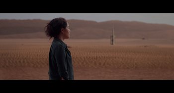Movie still from “Obi-Wan Kenobi: A Jedi's Return” (2022), directed by David Gelb – A woman standing in the middle of an empty field; Wide shot, Over the shoulder angle