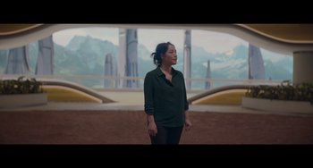 Movie still from “Obi-Wan Kenobi: A Jedi's Return” (2022), directed by David Gelb – A woman standing in front of an alien landscape; Medium shot, Over the shoulder angle