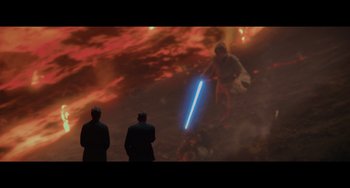 Movie still from “Obi-Wan Kenobi: A Jedi's Return” (2022), directed by David Gelb – Two men in suits looking at an image of a person with a lightsaber; Extreme Wide shot, Over the shoulder angle
