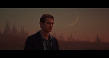 Movie still from “Obi-Wan Kenobi: A Jedi's Return” (2022), directed by David Gelb – A man standing in front of a sunset with trees in the background; Medium shot, Low angle