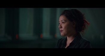 Movie still from “Obi-Wan Kenobi: A Jedi's Return” (2022), directed by David Gelb – A woman in a black shirt is looking to her left; Close Up shot, Low angle