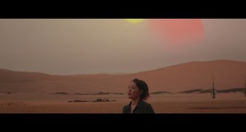 Movie still from “Obi-Wan Kenobi: A Jedi's Return” (2022), directed by David Gelb – A woman standing in the middle of a desert; Wide shot, Low angle
