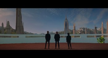 Movie still from “Obi-Wan Kenobi: A Jedi's Return” (2022), directed by David Gelb – Three men standing in front of a large building; Extreme Wide shot, Low angle