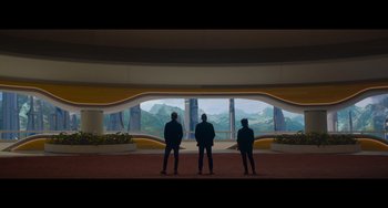 Movie still from “Obi-Wan Kenobi: A Jedi's Return” (2022), directed by David Gelb – Three people standing in front of a window; Extreme Wide shot, Low angle