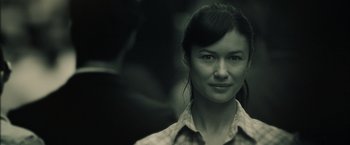 Movie still from “Oblivion” (2013), directed by Joseph Kosinski – A person wearing a plaid shirt; Close Up shot, Over the shoulder angle