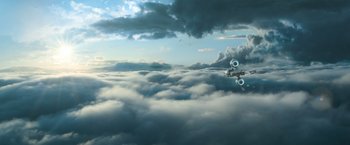 Movie still from “Oblivion” (2013), directed by Joseph Kosinski – An airplane flying through the clouds in the sky; Extreme Wide shot, Low angle