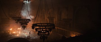 Movie still from “Oblivion” (2013), directed by Joseph Kosinski – A chandelier hanging from the ceiling in a room; Extreme Wide shot, High angle