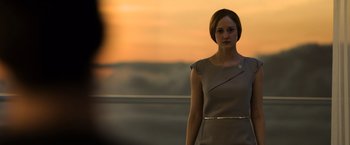 Movie still from “Oblivion” (2013), directed by Joseph Kosinski – A woman standing in front of a sunset; Medium shot, Over the shoulder angle