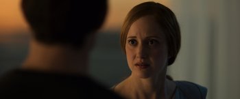 Movie still from “Oblivion” (2013), directed by Joseph Kosinski – A young woman looking at a man in a room; Close Up shot, Over the shoulder angle