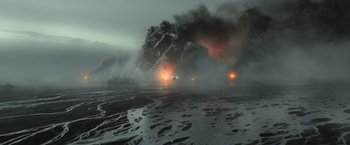 Movie still from “Oblivion” (2013), directed by Joseph Kosinski – Two cars on a body of water near a large fire; Extreme Wide shot, High angle