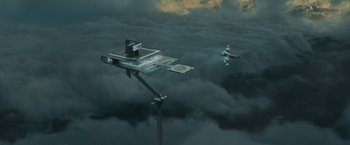 Movie still from “Oblivion” (2013), directed by Joseph Kosinski – An aerial view of two planes flying in the sky; Extreme Wide shot, Low angle