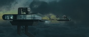 Movie still from “Oblivion” (2013), directed by Joseph Kosinski – A man standing on top of a building in the middle of the night; Extreme Wide shot, Low angle