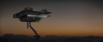 Movie still from “Oblivion” (2013), directed by Joseph Kosinski – An airplane flying in the sky at sunset; Extreme Wide shot, Low angle