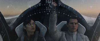 Movie still from “Oblivion” (2013), directed by Joseph Kosinski – A man and a woman sitting in an airplane cockpit; Close Up shot, Low angle