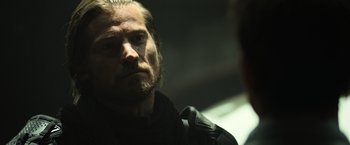 Movie still from “Oblivion” (2013), directed by Joseph Kosinski – A person with a beard looking into a mirror; Close Up shot, Over the shoulder angle