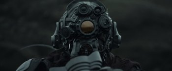 Movie still from “Oblivion” (2013), directed by Joseph Kosinski – A person wearing a gas mask; Close Up shot, Low angle