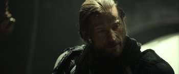 Movie still from “Oblivion” (2013), directed by Joseph Kosinski – A person with a beard; Close Up shot, Over the shoulder angle