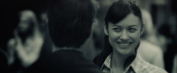 Movie still from “Oblivion” (2013), directed by Joseph Kosinski – A man and a woman smiling for the camera; Close Up shot, Over the shoulder angle