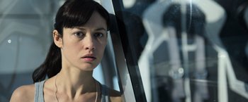 Movie still from “Oblivion” (2013), directed by Joseph Kosinski – A person looking out of a window; Close Up shot, Over the shoulder angle