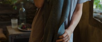 Movie still from “Oblivion” (2013), directed by Joseph Kosinski – A person holding a blanket in their hands; Extreme Close Up shot, High angle