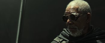 Movie still from “Oblivion” (2013), directed by Joseph Kosinski – An older man wearing sunglasses looking at the camera; Close Up shot, Low angle