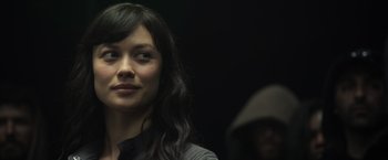 Movie still from “Oblivion” (2013), directed by Joseph Kosinski – A person wearing a hat; Close Up shot, Over the shoulder angle