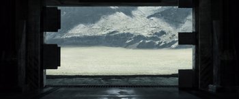 Movie still from “Oblivion” (2013), directed by Joseph Kosinski – A view of a snowy mountain from a window; Extreme Wide shot, High angle