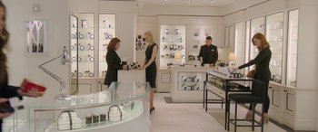 Movie still from “Ocean's Eight” (2018), directed by Gary Ross – Two women in a jewelry store looking at watches; Wide shot, Over the shoulder angle