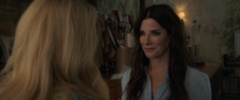 Movie still from “Ocean's Eight” (2018), directed by Gary Ross – Sandra bullock in a scene from the movie ocean's eight; Close Up shot, Over the shoulder angle