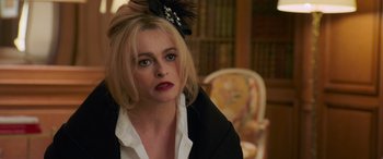 Movie still from “Ocean's Eight” (2018), directed by Gary Ross – A person wearing a suit and tie; Close Up shot, High angle