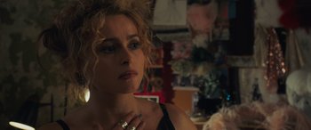 Movie still from “Ocean's Eight” (2018), directed by Gary Ross – A person wearing a ring; Close Up shot, Over the shoulder angle