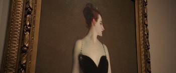 Movie still from “Ocean's Eight” (2018), directed by Gary Ross – A woman in a black dress with a chain around her neck; Close Up shot, Low angle