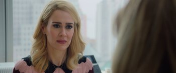 Movie still from “Ocean's Eight” (2018), directed by Gary Ross – A person sitting in front of a mirror; Close Up shot, Over the shoulder angle