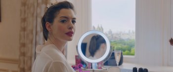 Movie still from “Ocean's Eight” (2018), directed by Gary Ross – A beautiful woman standing in front of a mirror; Close Up shot, Over the shoulder angle
