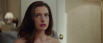 Movie still from “Ocean's Eight” (2018), directed by Gary Ross – A person with long hair looking at a mirror; Close Up shot, Over the shoulder angle