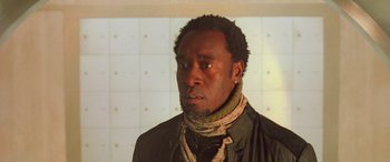 Movie still from “Ocean's Eleven” (2001), directed by Steven Soderbergh – A man with a beard and a scarf around his neck; Close Up shot, Low angle