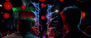 Movie still from “Ocean's Eleven” (2001), directed by Steven Soderbergh – A group of people on a pole performing a dance; Wide shot, Low angle