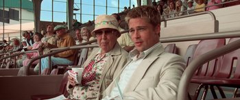 Movie still from “Ocean's Eleven” (2001), directed by Steven Soderbergh – Two men are sitting in the stands at a baseball game; Medium shot, Over the shoulder angle