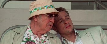 Movie still from “Ocean's Eleven” (2001), directed by Steven Soderbergh – A man and an older man sitting next to each other; Close Up shot, Low angle