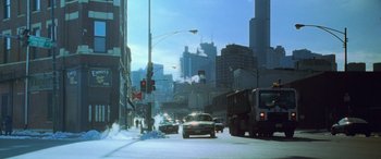 Movie still from “Ocean's Eleven” (2001), directed by Steven Soderbergh – A street scene with cars driving down the road; Extreme Wide shot, Low angle