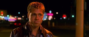 Movie still from “Ocean's Eleven” (2001), directed by Steven Soderbergh – A person with a cigarette in his mouth; Close Up shot, Low angle