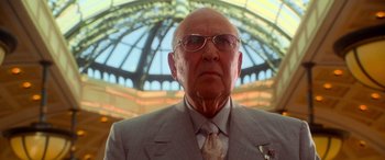 Movie still from “Ocean's Eleven” (2001), directed by Steven Soderbergh – An older man wearing a suit and tie; Close Up shot, Low angle