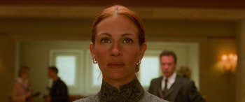 Movie still from “Ocean's Eleven” (2001), directed by Steven Soderbergh – A person wearing a suit and tie; Close Up shot, Low angle