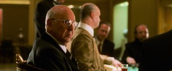Movie still from “Ocean's Eleven” (2001), directed by Steven Soderbergh – A group of men sitting next to each other in a room; Close Up shot, Over the shoulder angle