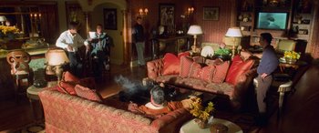 Movie still from “Ocean's Eleven” (2001), directed by Steven Soderbergh – A living room filled with couches and a table; Wide shot, High angle
