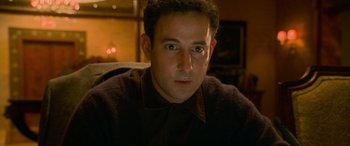 Movie still from “Ocean's Eleven” (2001), directed by Steven Soderbergh – A person wearing a shirt and tie; Close Up shot, High angle