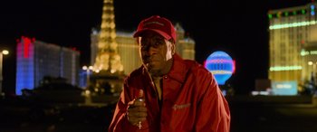 Movie still from “Ocean's Eleven” (2001), directed by Steven Soderbergh – A man in a red jacket holding a wine glass; Close Up shot, Low angle