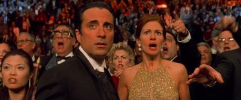 Movie still from “Ocean's Eleven” (2001), directed by Steven Soderbergh – A man and a woman in front of an audience; Medium shot, Low angle