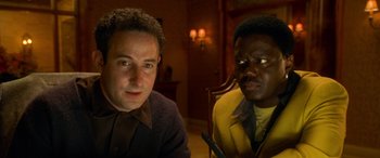 Movie still from “Ocean's Eleven” (2001), directed by Steven Soderbergh – Two men sitting in front of each other in a room; Close Up shot, High angle